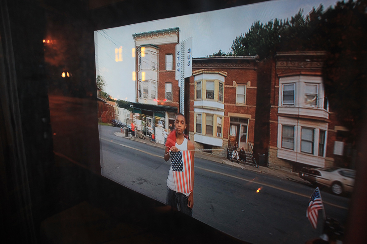 reflection-of-north-troy-slide-show-in-window-of-ntphm